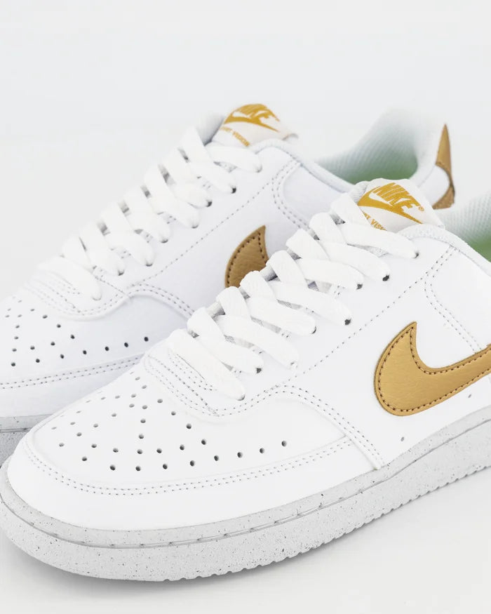 White and top gold nike sneakers
